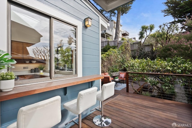 wooden deck featuring fence