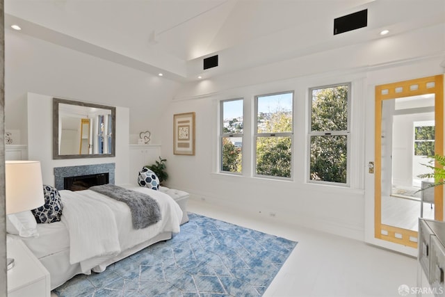 bedroom featuring recessed lighting and a fireplace