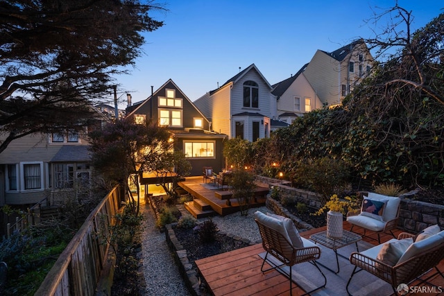 exterior space with an outdoor living space and fence