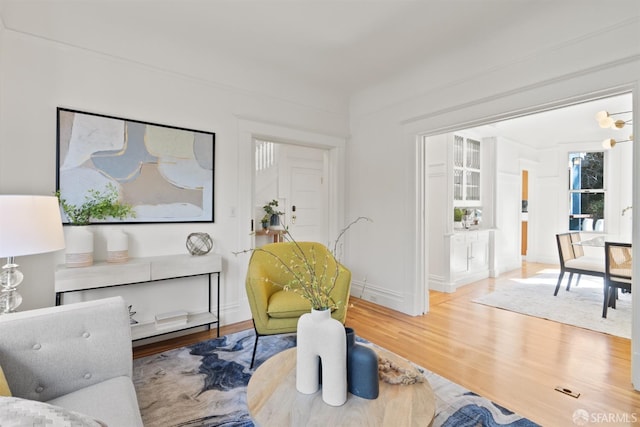 living room featuring baseboards and wood finished floors