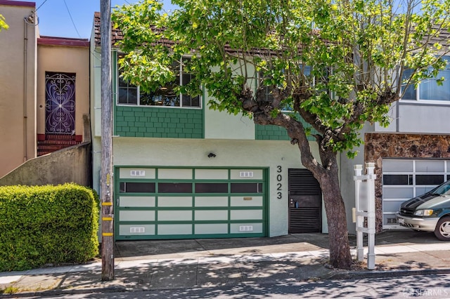 3023 Alemany Blvd, San Francisco, CA 94112 - view of building exterior featuring a garage and concrete driveway