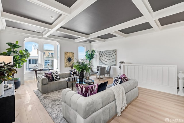 living room featuring crown molding, beamed ceiling, coffered ceiling, and light wood-type flooring