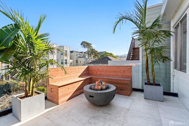 view of patio with a fire pit