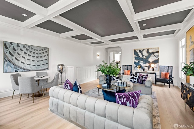 living area featuring a wealth of natural light, beam ceiling, coffered ceiling, and wood finished floors