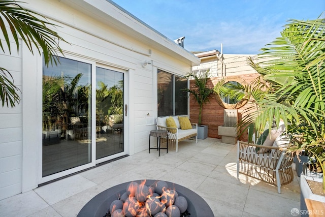 view of patio with a fire pit