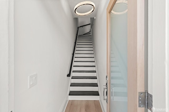 staircase featuring hardwood / wood-style flooring