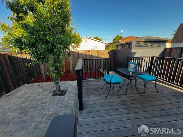 590 Hurlingame Ave, Redwood City, CA 94063 - wooden deck with a fenced backyard, outdoor dining area, and a patio