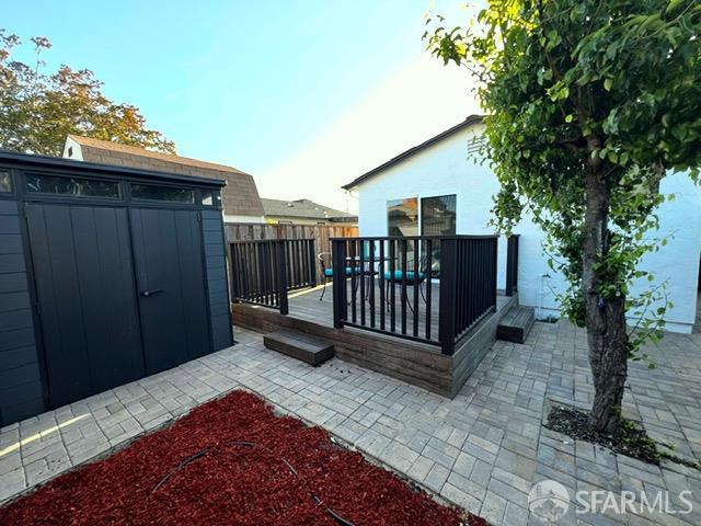 590 Hurlingame Ave, Redwood City, CA 94063 - gate featuring a deck and a patio