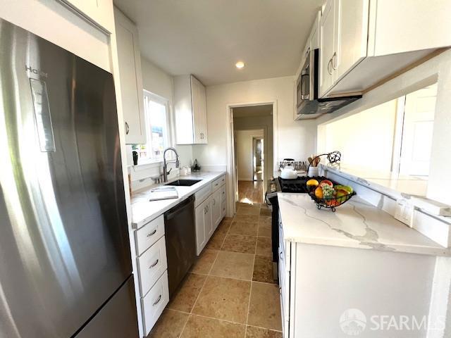590 Hurlingame Ave, Redwood City, CA 94063 - kitchen with stainless steel appliances, a sink, white cabinetry, light stone countertops, and recessed lighting