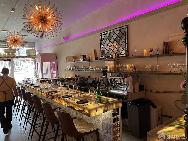 bar featuring light tile patterned floors