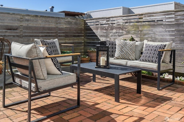 view of patio / terrace featuring fence