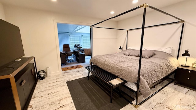 bedroom featuring light wood finished floors and recessed lighting