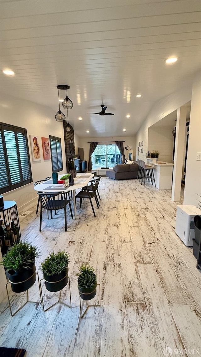 interior space with an outdoor hangout area, ceiling fan, outdoor dining area, and exterior kitchen