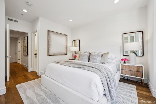 bedroom featuring dark hardwood / wood-style flooring