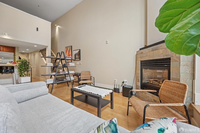 700 Illinois St Unit 3, San Francisco, CA 94107 - living room with a towering ceiling, light wood-type flooring, and a fireplace