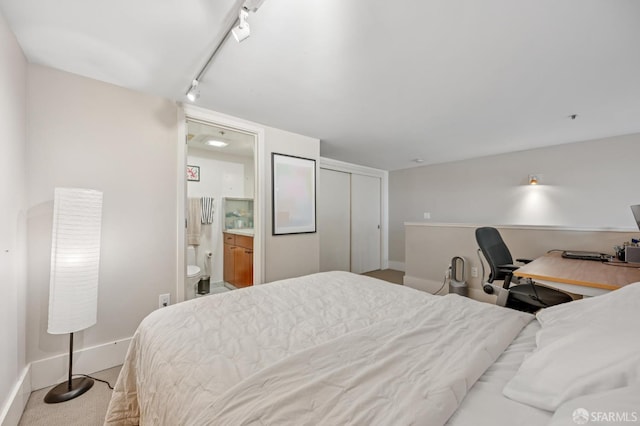 700 Illinois St Unit 3, San Francisco, CA 94107 - bedroom with ensuite bath, carpet flooring, an office area, rail lighting, and a closet