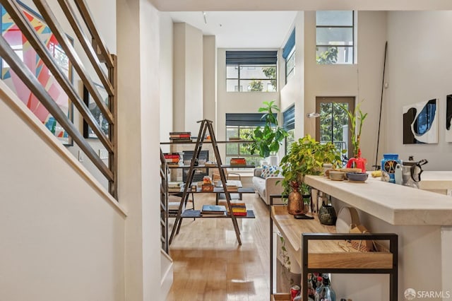 700 Illinois St Unit 3, San Francisco, CA 94107 - foyer with a high ceiling, healthy amount of natural light, wood finished floors, and stairs