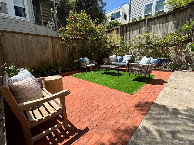 2440 Clay St, San Francisco, CA 94115 - view of patio with outdoor lounge area and a fenced backyard