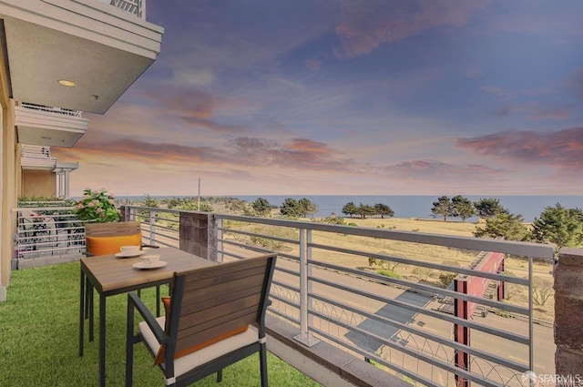 view of balcony at dusk