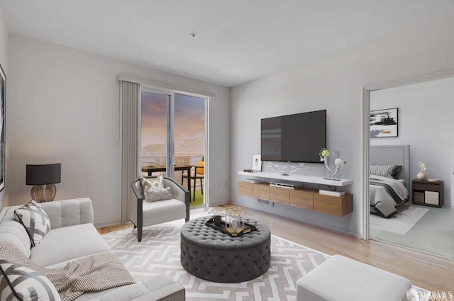 living room featuring visible vents and light wood-style flooring