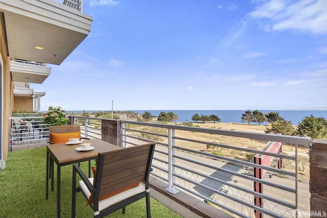 balcony featuring a water view