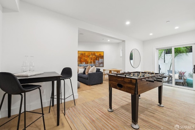 recreation room featuring light wood finished floors and recessed lighting