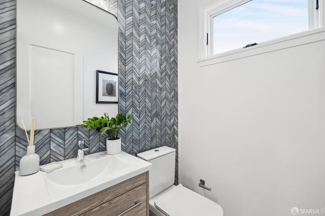 bathroom with vanity and toilet