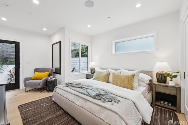 bedroom featuring recessed lighting and light wood-style floors