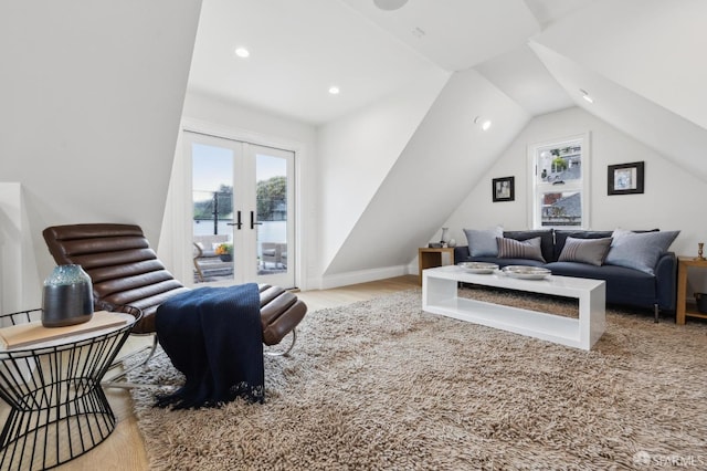 living area featuring wood finished floors, recessed lighting, french doors, baseboards, and vaulted ceiling