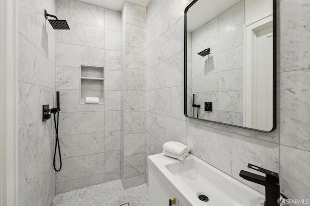 bathroom featuring tile walls and tiled shower