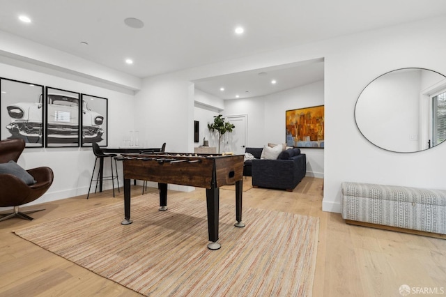 recreation room with recessed lighting, baseboards, and light wood-style flooring