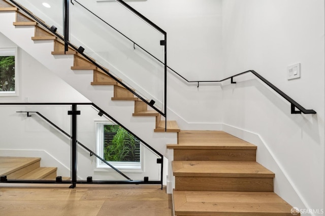 stairs with wood finished floors