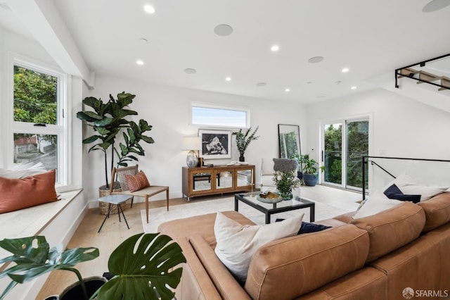 living room with recessed lighting, stairs, and light wood-type flooring