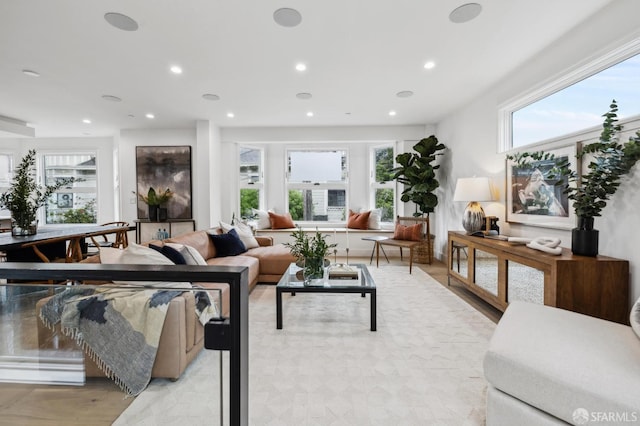 living room with recessed lighting and light wood-type flooring