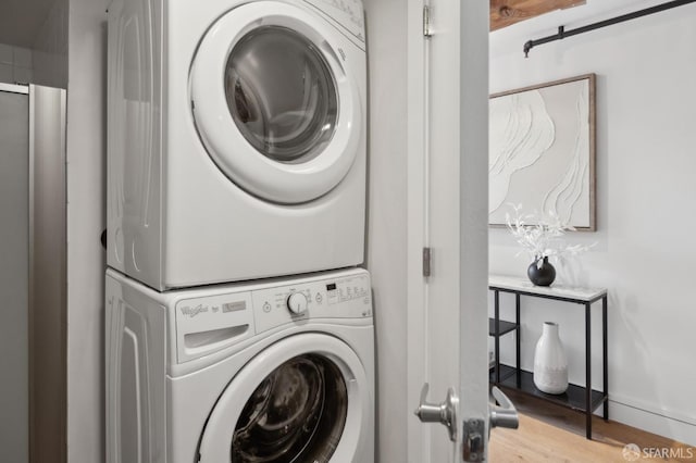 2011 3rd St Unit 6, San Francisco, CA 94107 - laundry area with stacked washer and clothes dryer and wood finished floors