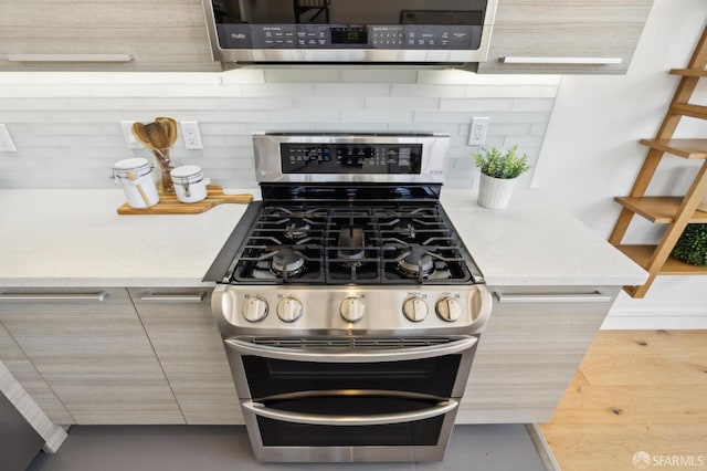 2011 3rd St Unit 6, San Francisco, CA 94107 - kitchen featuring stainless steel appliances, tasteful backsplash, and light countertops