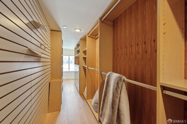 2011 3rd St Unit 6, San Francisco, CA 94107 - walk in closet featuring light wood-style flooring