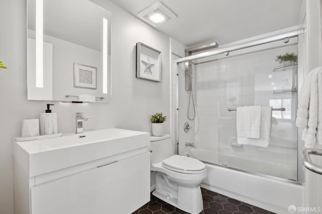 2011 3rd St Unit 6, San Francisco, CA 94107 - bathroom featuring vanity, toilet, enclosed tub / shower combo, and tile patterned flooring