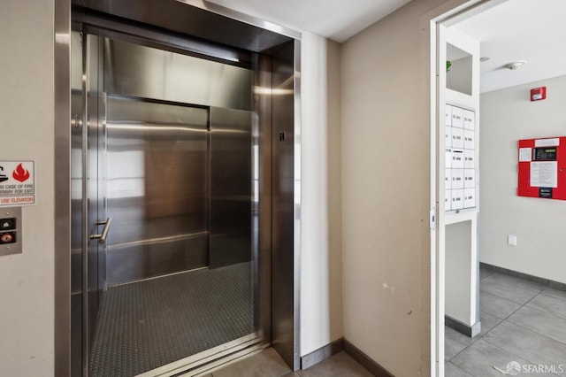2011 3rd St Unit 6, San Francisco, CA 94107 - elevator featuring baseboards, a fire alarm, and a smoke detector