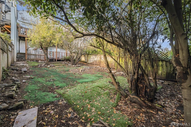 view of yard with a wooden deck