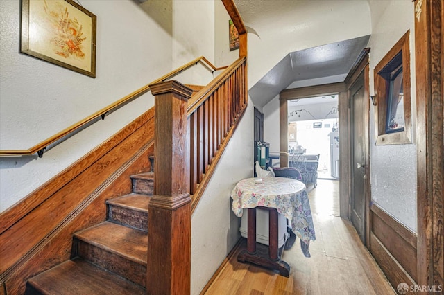 staircase featuring hardwood / wood-style floors