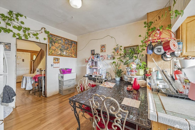 dining area featuring light wood-type flooring