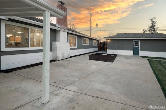 view of patio terrace at dusk