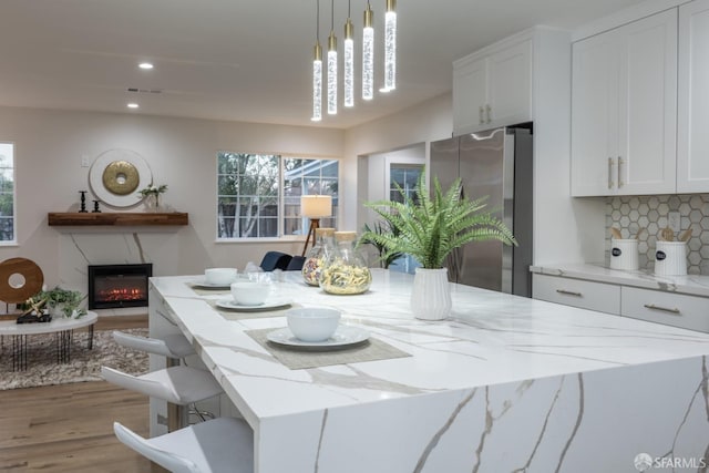 dining room featuring light hardwood / wood-style flooring