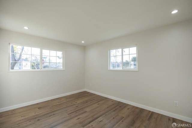 empty room featuring wood-type flooring