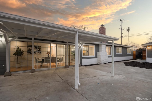 view of patio terrace at dusk