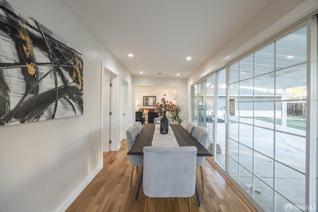 dining space featuring hardwood / wood-style flooring