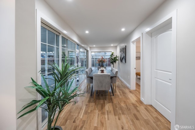 hallway with light wood-type flooring