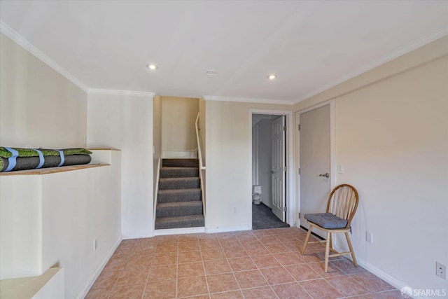 stairs with tile patterned floors and ornamental molding