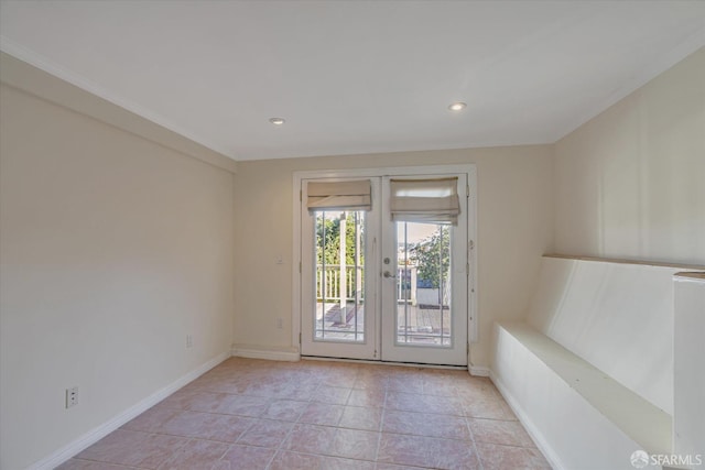 entryway with light tile patterned floors and french doors